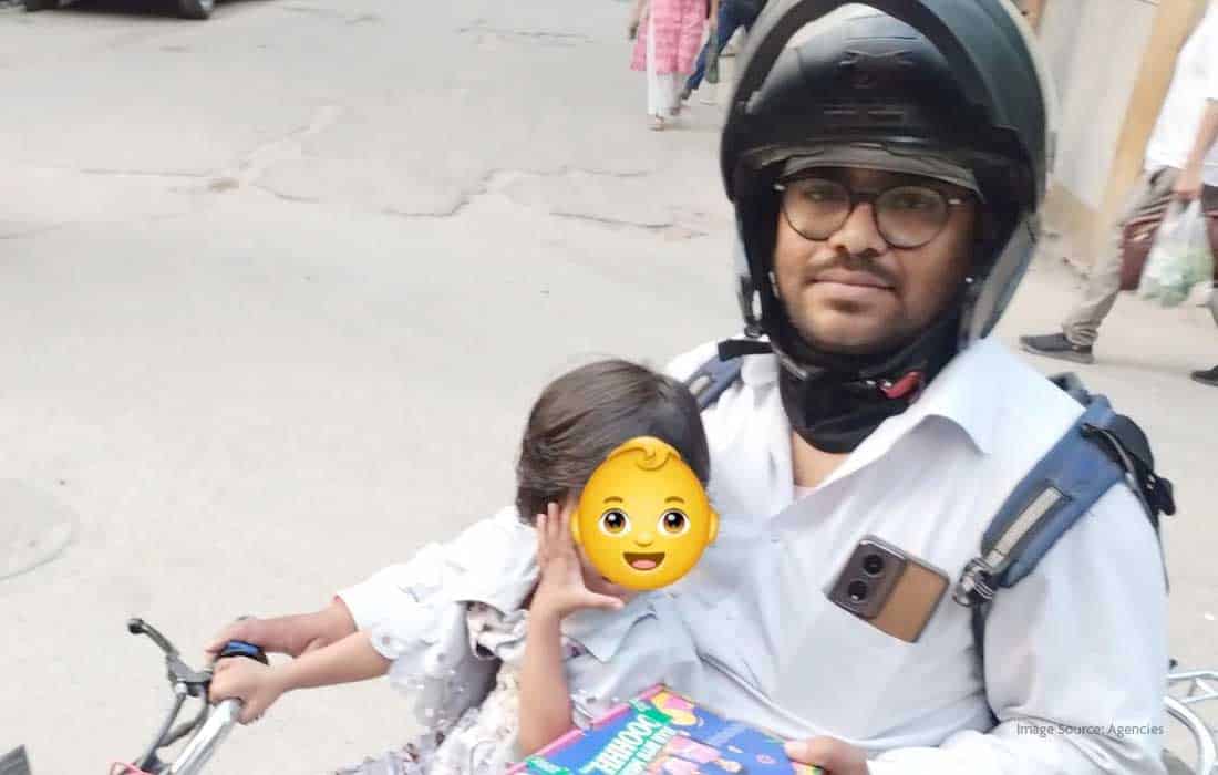 Swiggy delivery agent seen with daughter during shift